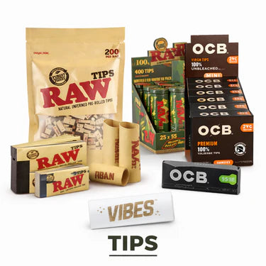 Assortment of rolling paper tips and brands including RAW, OCB, and Vibes, displayed in their packaging with some loose tips arranged nearby.