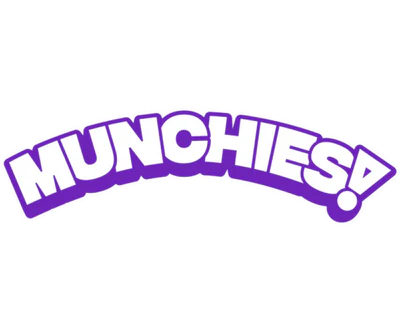Bold, purple text saying "MUNCHIES!" outlined in white and arched upward on a transparent background.