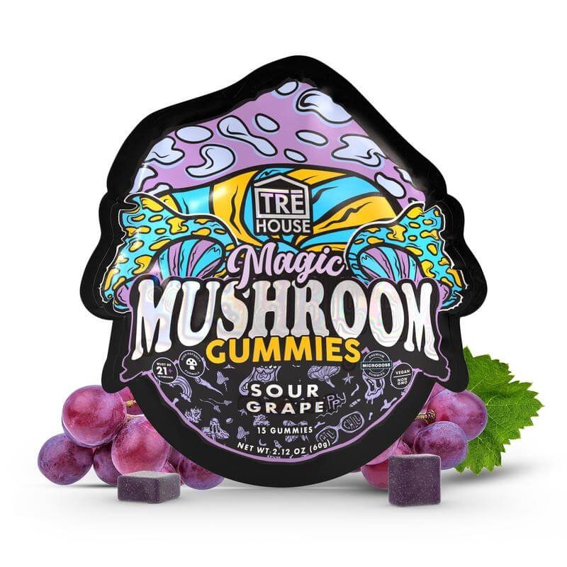 Colorful packaging of Magic Mushroom Gummies in sour grape flavor with purple grapes and two purple gummy pieces placed in front, designed for a smoke shop audience.